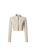 Mkeyzee London beige linen cropped jacket with a high stand collar, structured shoulders, and curved front seam.