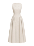 Mkeyzee London beige linen dress with a structured bodice, tonal piping, and a full gathered skirt.