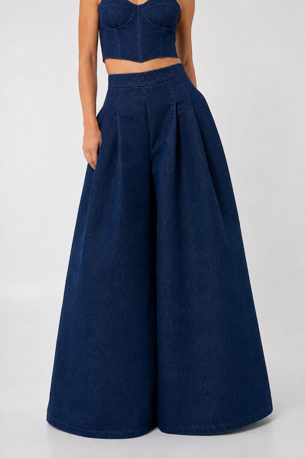 Mkeyzee London dark indigo denim trousers featuring an extreme wide-leg silhouette, high waist, and front pleats.