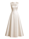 Mkeyzee London Delianna gown in ivory duchess satin with a structured sleeveless bodice and voluminous skirt.