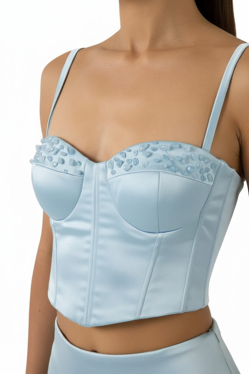 Mkeyzee London Elara Dusk corset top in light blue silk duchess with hand-applied natural aquamarine stone detailing.