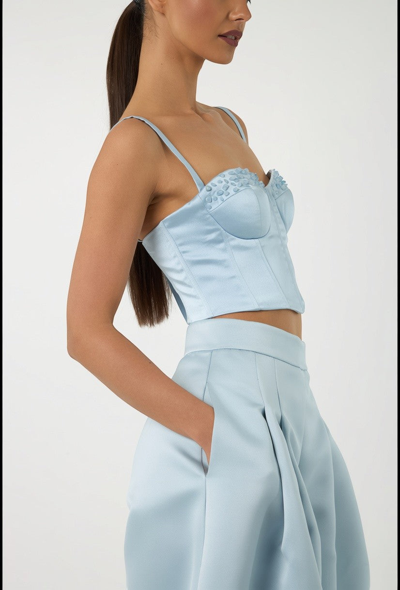 Mkeyzee London Elara Dusk corset top in soft blue silk duchess with hand-applied aquamarine stones on sculpted cups.