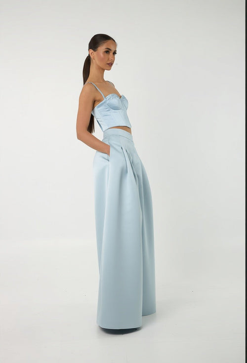 Model wearing Mkeyzee London Elara Dusk light blue silk corset top with aquamarine stone detailing and matching trousers
