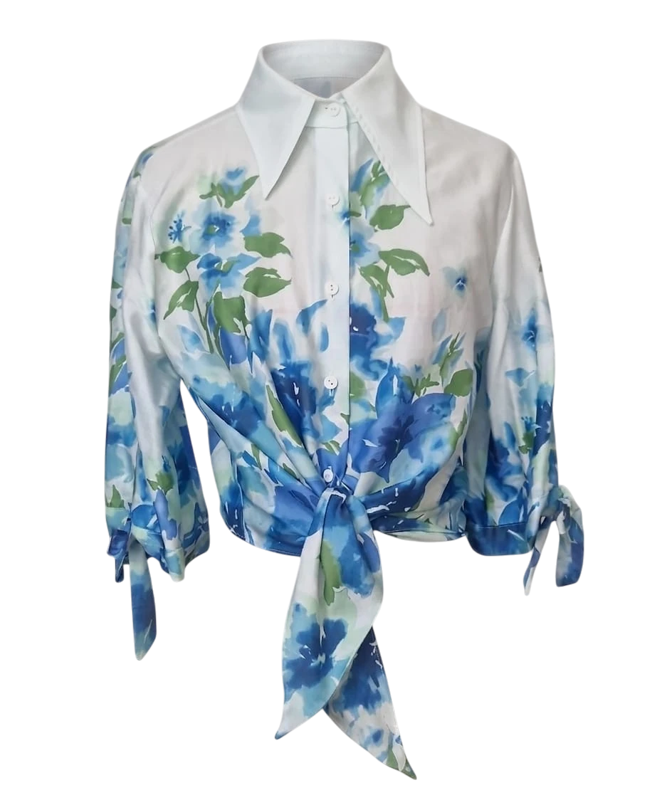Mkeyzee London Fiorella cropped cotton shirt in white with a blue and green floral print and front tie detail.