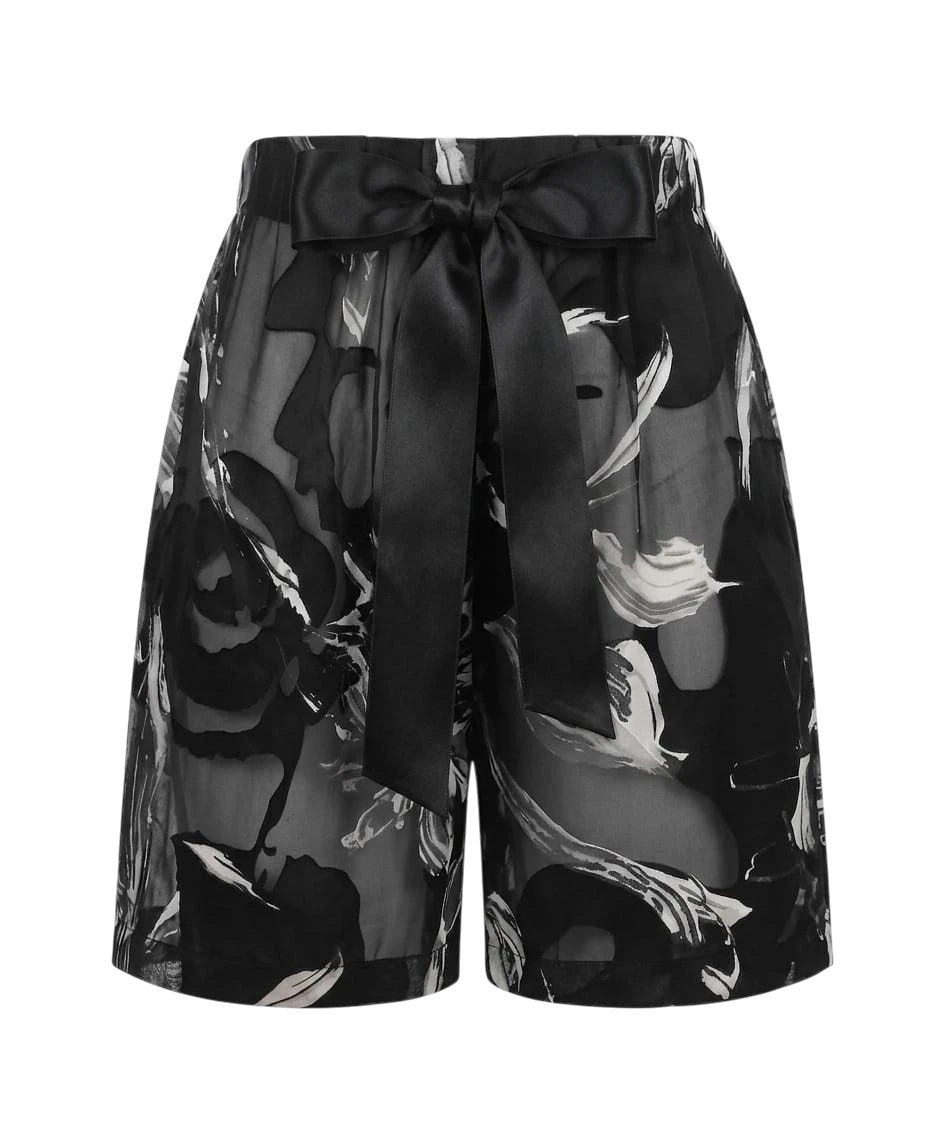 Mkeyzee London Selene silk shorts in black and white floral print with an elastic waistband and satin ribbon tie.