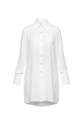 Mkeyzee London IZALIE white cotton shirt dress featuring an asymmetrical collar and front shell buttons.
